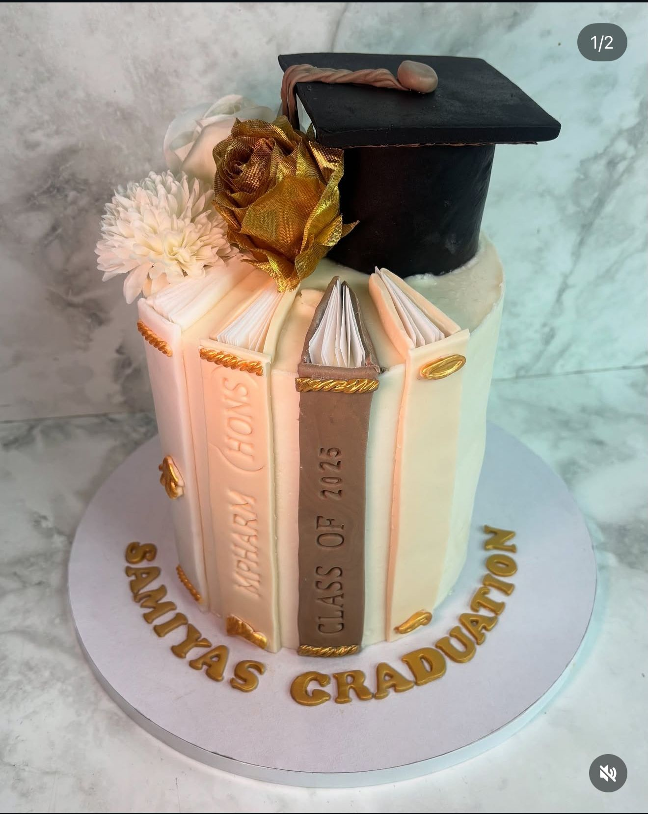 Custom graduation cake with mortarboard and book design — Desi Cakes & Shakes Oldham